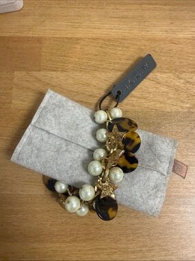 J crew chain bracelet with faux pearl, tortoise chips and glitter star charms